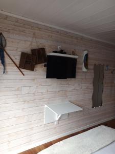 a room with a wall with a flat screen tv at LA MAISON DES HIPPOCAMPES in La Teste-de-Buch