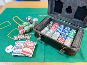 a suitcase full of dominoes on a table at ura AddressHokancho in Okayama