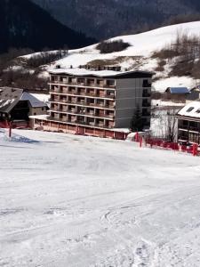a hotel on top of a snow covered mountain at Le Ptit Beau Jus in Aillon-le-Jeune