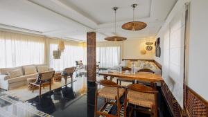 a kitchen and living room with a table and chairs at Hotel Dakhla Club & SPA in Dakhla
