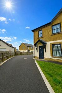 a driveway in front of a house at North Coast Nook in Portrush