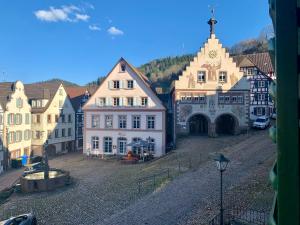 a group of buildings on a cobblestone street at Gasthof Sonne in Schiltach