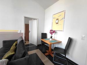 a living room with a couch and a table at Ferienwohnung CityImmo in Gotha