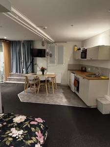 a kitchen and dining room with a table and chairs at Welcome in Issy-les-Moulineaux