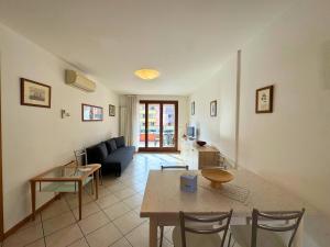 a living room with a couch and a table at Stella Marina in Grado