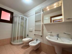 a bathroom with a shower and a toilet and a sink at Stella Marina in Grado +20 photos