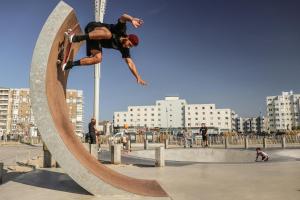 a man doing a trick on a skateboard on a ramp at Studio - Plage de Calais - Skatebeach in Calais +5 photos
