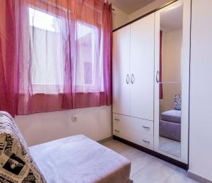Posteľ alebo postele v izbe v ubytovaní Apartmani Lusi
