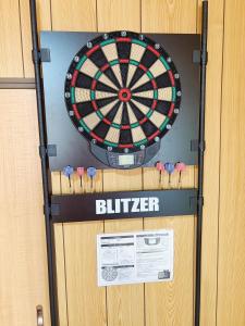 a dartboard on the wall of a locker at Garden-View ゆふ in Yufu +55 photos