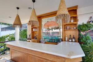 a bar with a white counter in a room at NATURELLA APART HOTEL in Kemer