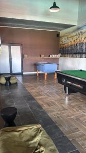 a billiard room with a pool table and a pool table at Elara in Sandton