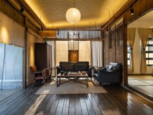 a living room with a couch and a table at Limu Mountain Forest Park in Hainan