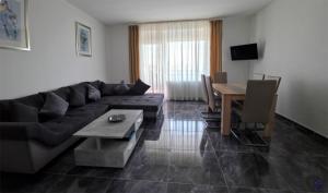 a living room with a couch and a table at Hotel Sofia in Bad Wildungen