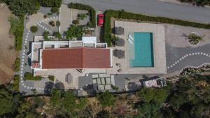 an overhead view of a building with a swimming pool at J&K Villa in Kalithies