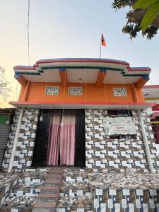 a building with a flag on top of it at New Giri Homestay in Nichlaul