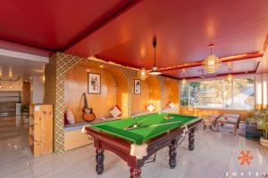 a room with a pool table in it at Zostel Dharamkot, Bhagsu in McLeod Ganj