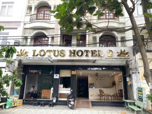 a hotel with a motorcycle parked in front of it at LotusHotel 2 in Ho Chi Minh City