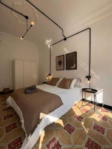 a bedroom with a large bed in a room at Terrazas de la Catedral II in Castellón de la Plana