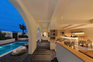 a villa with a swimming pool and a dining area at Mountain Resort Hotel in Dali