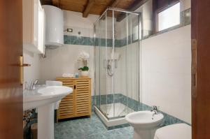a bathroom with two sinks and a shower at Tenuta La Chiusa in Portoferraio +95 photos