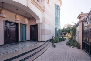 a bike parked on a sidewalk next to a building at Full Moon Guesthouse in Dubai