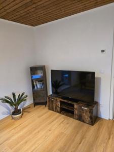 a living room with a large flat screen tv at NEUBEGINN b in Bad Rodach