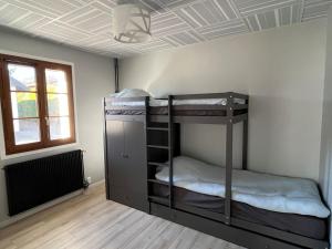 two bunk beds in a room with a ceiling at L'auberge de Charance in Gap