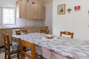 a kitchen with a table with a bowl on it at Guest House Margherita in Caserta