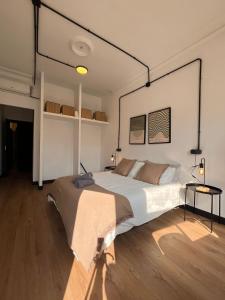 a bedroom with a large bed in a room at Terrazas de la Catedral III in Castellón de la Plana
