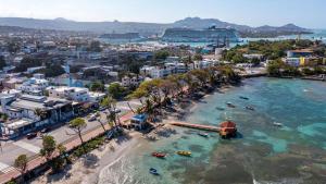 an aerial view of a beach with boats in the water at Bijoc 01 Apartment in San Felipe de Puerto Plata
