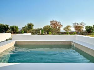 a pool of water on the roof of a house at Cozy Hideaway Room with Private Jacuzzi in Krotiri