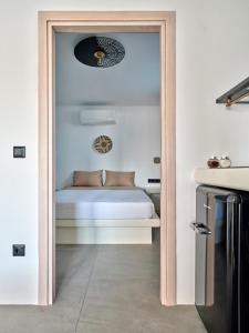 a door leading to a bedroom with a bed at Cozy Hideaway Room with Private Jacuzzi in Krotiri +4 photos