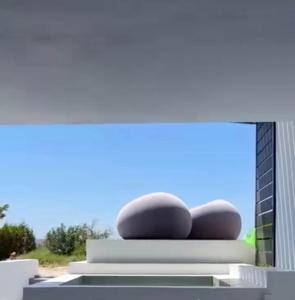 a rendering of a building with two spheres on it at Cozy Hideaway Room with Private Jacuzzi in Krotiri