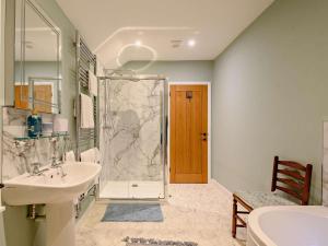 a bathroom with a sink and a shower at 3 Bed in Lockerbie oc-89759 in Ecclefechan