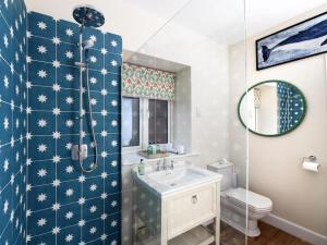 a bathroom with a shower and a sink and a toilet at 3 Bed in Lockerbie oc-95861 in Brydekirk +16 photos