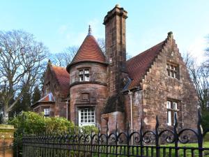 an old brick house with a black iron fence at 3 Bed in Lockerbie oc-95861 in Brydekirk