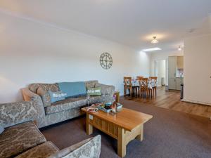 a living room with a couch and a table at 2 Bed in Biggar oc-95516 in Biggar +12 photos