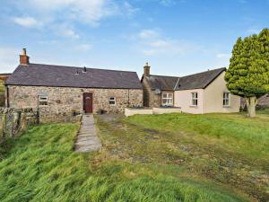 an old stone house on a grassy field at 1 Bed in Edzell oc-ca335 in Edzell