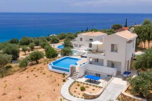 an aerial view of a villa with a swimming pool at Villa Michou Helios by Villa Plus in Lourdata