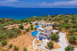 an aerial view of a villa with a swimming pool at Villa Michou Helios by Villa Plus in Lourdata