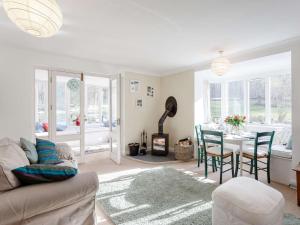 a living room with a couch and a table at 3 Bed in Turriff oc-75489 in Turriff