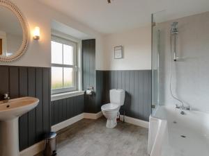 a bathroom with a toilet and a sink and a shower at 3 Bed in Crieff oc-78313 in Madderty +44 photos