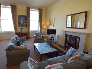a living room with a couch and a fireplace at 3 Bed in Edinburgh oc-79008 in Edinburgh