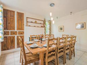 a dining room with a wooden table and chairs at 6 Bed in Keswick oc-sz044 in Braithwaite