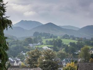 a view of a town with mountains in the background at 6 Bed in Keswick oc-sz044 in Braithwaite