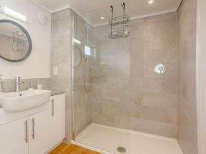 a bathroom with a shower and a sink and a mirror at 2 Bed in Isle Of Skye oc-87578 in Portree +7 photos