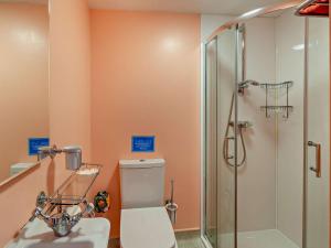 a bathroom with a toilet and a shower at 4 Bed in Penrith oc-94247 in Greystoke +25 photos