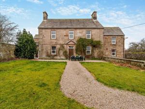 an old brick house with a grassy yard at 4 Bed in Penrith oc-94247 in Greystoke