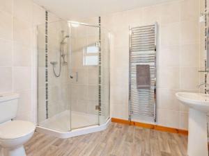 a bathroom with a shower and a toilet and a sink at 2 Bed in Brechin oc-ca300 in Edzell +17 photos