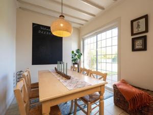 a dining room with a wooden table and chairs at 3 Bed in Gullane oc-96141 in Gullane